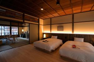 Katil atau katil-katil dalam bilik di NIPPONIA HOTEL Ozu Castle Town