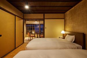 Katil atau katil-katil dalam bilik di NIPPONIA HOTEL Ozu Castle Town