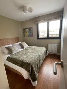 a bedroom with a bed and a window at Les Ferreries Saillagouse in Saillagouse +23 photos