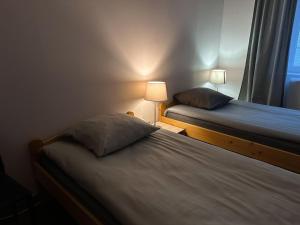 Posteľ alebo postele v izbe v ubytovaní Appart O'key