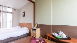 Voodi või voodid majutusasutuse Tabist International Hotel Kaike toas
