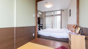 Voodi või voodid majutusasutuse Tabist International Hotel Kaike toas