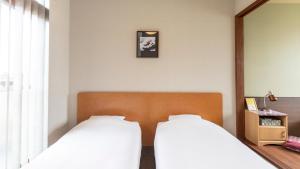 Voodi või voodid majutusasutuse Tabist International Hotel Kaike toas