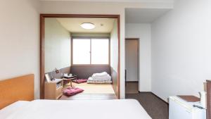 Voodi või voodid majutusasutuse Tabist International Hotel Kaike toas
