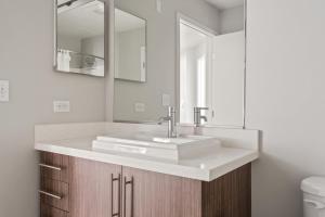 a bathroom with a sink and a mirror at Redwood City 1BR w Gym WD next to Caltrain SFO-1046 in Redwood City +25 photos