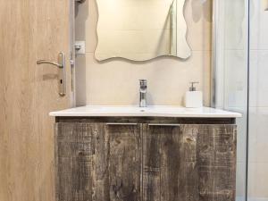 a bathroom with a sink and a mirror at Glamorous & Spacious Renovated Apartment, Syntagma, DT Athens in Athens