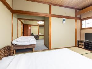 Voodi või voodid majutusasutuse Tabist International Hotel Kaike toas