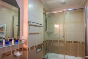 a bathroom with a shower with a glass door at Ramos Boutique Hotel Sultanahmet in Istanbul