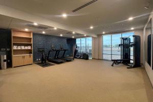 a gym with treadmills and machines in a building at La Quinta Inn & Suites by Wyndham Yuma in Yuma