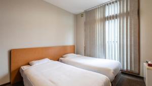 Voodi või voodid majutusasutuse Tabist International Hotel Kaike toas