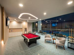 a room with a pool table and a ping pong ball at Sunway Sanctuary - Seniors Hotel & Residences in Subang Jaya