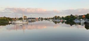 a group of boats are docked in a harbor at Haus Nika in Carolinensiel in Carolinensiel