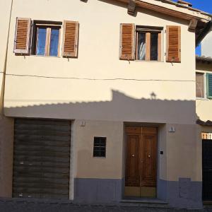 a house with two garage doors and two windows at Lilium Domus in Florence