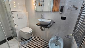 a small bathroom with a sink and a toilet at Lilium Domus in Florence