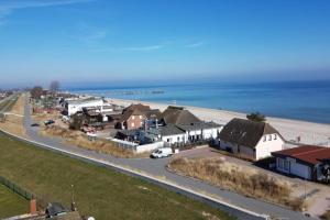 an aerial view of a small town next to the beach at Strandhotel Wohnung 68 in Dahme