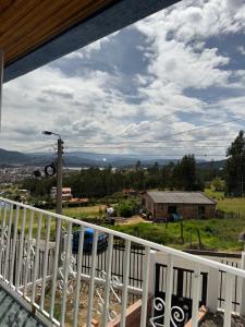 a view from the balcony of a house at Cabaña El Recuerdo, Paipa in Paipa +4 photos