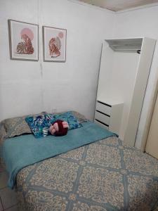 Кровать или кровати в номере Casa a poucos passos do Museu da Amazônia