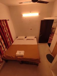A bed or beds in a room at SAND BEACH HOUSE VARKALA