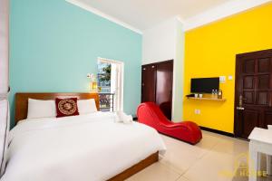 En eller flere senger på et rom på Bãi Sau Villa Hotel TP Vũng Tàu