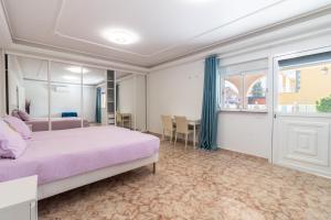 Postel nebo postele na pokoji v ubytování Flatguest Sonneland Suite