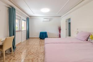 Postel nebo postele na pokoji v ubytování Flatguest Sonneland Suite