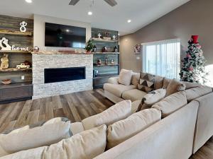a living room with a couch and a christmas tree at Crown Jewel in Ruidoso