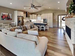 a large living room with a couch and a kitchen at Crown Jewel in Ruidoso