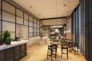 rendering restauracji ze stołami i krzesłami w obiekcie Bomonti Arjaan by Rotana w Stambule