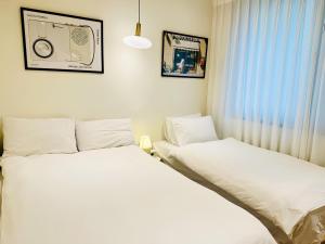 Voodi või voodid majutusasutuse SSH Ikseon peter cat Hostel toas