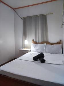 Postel nebo postele na pokoji v ubytování Hidden Gem Siargao