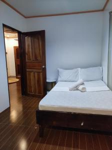 Postel nebo postele na pokoji v ubytování Hidden Gem Siargao