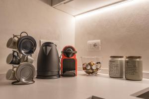 a kitchen counter with various appliances on a counter top at Veronetta The Cellar in Verona