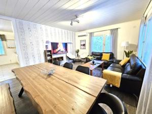 a living room with a couch and a table at Property in Vaasa in Vaasa