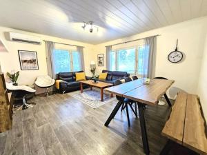 a living room with a couch and a table at Property in Vaasa in Vaasa