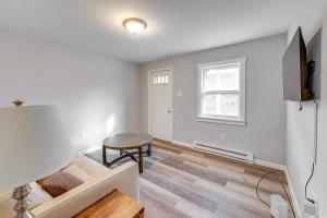 a living room with a couch and a table at Updated Minersville Townhome by ATV Trail! in Mount Pleasant
