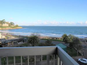 a view of the ocean from the balcony of a condo at Appartement à Perros-Guirec avec Vue Panoramique, Terrasse et Parking Privé - FR-1-368-271 in Perros-Guirec +17 photos