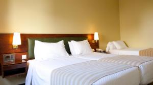 Postel nebo postele na pokoji v ubytování Hotel Sao Jose