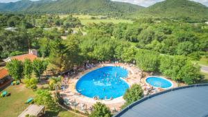 an overhead view of a swimming pool in a park at Domingo Design Hotel in Santa Rosa de Calamuchita