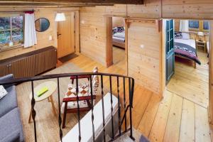 an overhead view of a cabin with a staircase and a bedroom at Ski-in & Ski-out out Chalet Maria with amazing mountain view in Maria Alm am Steinernen Meer