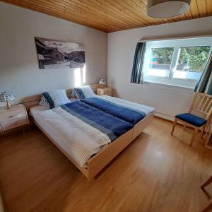 Postel nebo postele na pokoji v ubytování B&B Chalet Rustica Inden, Leukerbad