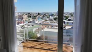 a balcony with a view of a city at APA Centro 2505 - con hidromasaje in Puerto Madryn