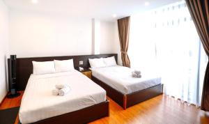 Postel nebo postele na pokoji v ubytování TTR Midtown View Hotel