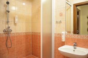 a bathroom with a shower and a sink at WenderEDU Business Center in Wrocław +59 photos