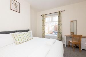 A bed or beds in a room at The Westlands Apartment High Barnes Sunderland