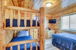 a bedroom with two bunk beds in a log cabin at Eagles Nest Cabin on Mille Lacs Lake Boat and Fish in Garrison