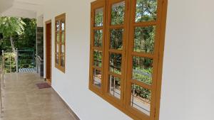 an empty hallway with doors and windows at Silver home stay vagamon in Vagamon