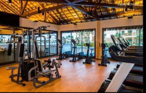 a gym with several treadmills and exercise bikes at VG Sun Cumbuco - Apartamento por Temporada na Praia do Cumbuco in Cumbuco