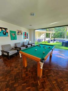 a living room with a pool table in it at Panorama Hotel in Águas de Lindoia