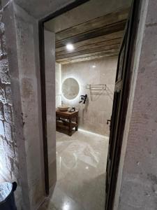 a bathroom with a sink and a mirror at Chakra Special Caves in Urgup