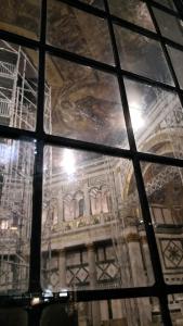 a view through a glass window of a building at Tre Gigli Firenze BB, 5 minutes from station, via Palazzuolo 55 in Florence